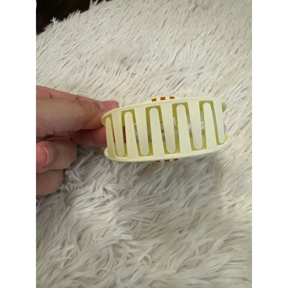 Large yellow cat hair clip claw with orange stripes on ears and forehead